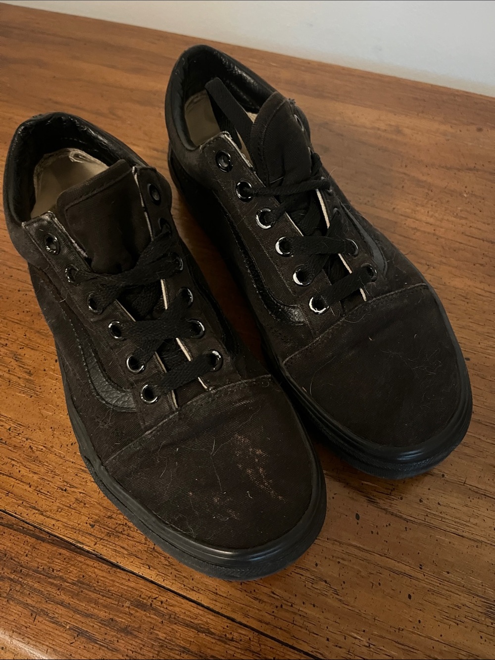 Black vans with leather detail